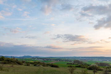 Fototapeta premium landscape with clouds and a village in spring