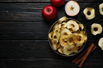 Concept of tasty food, dried apple chips, space for text