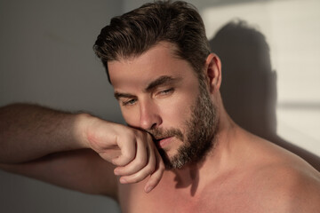 Obraz premium Close up portrait of handsome man. Portrait of shirtless man for skincare and beauty concepts. Handsome man with beauty face, facial skin portrait. Male healthy skin and spa concept.