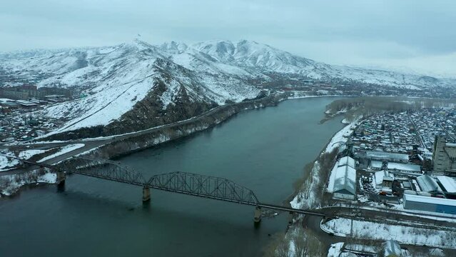 bird's-eye view of mountains, river and city winter day, panoramic view of mountains near the river, Ust Kamenogorsk, Kazakhstan.
