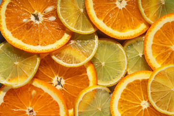 Background of round cut citrus fruits orange and lemon.