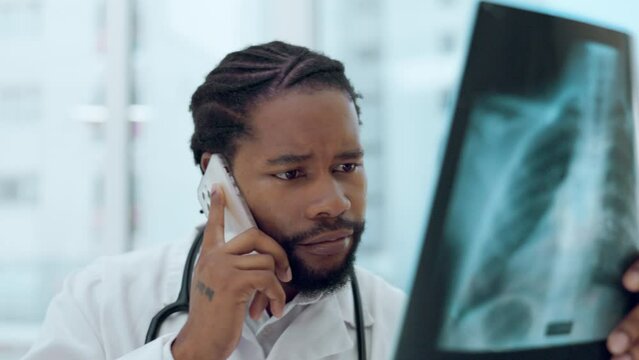 Male doctor, xray and phone call for talk with news for lungs, asma and cardiology in clinic. Black man, medic and radiology results for tuberculosis, lung infection or healthcare report on cellphone