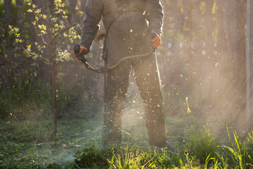 Naklejka premium Lawn mover on green grass. Machine for cutting lawns.