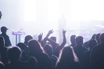 Obraz premium Crowd at concert and blurred stage lights.