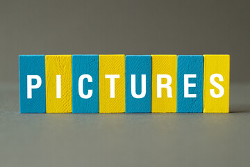 Pictures - word concept on building blocks