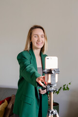 Woman makes professional video blog and stream using a smartphone.