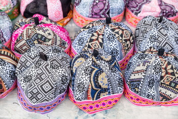 Hmong males' traditional headwear is sold at a street market