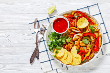 chicken fajitas with peppers, onion, taco chips