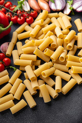 raw pasta rigatoni ingredient meal food snack on the table copy space food background rustic top view