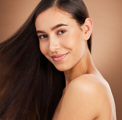 Hair, salon and portrait of woman in studio for wellness, hairstyle treatment and health on brown...