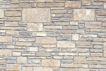 Solid gray and beige stone wall, good for background