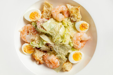 Fototapeta na wymiar Caesar salad with shrimp,