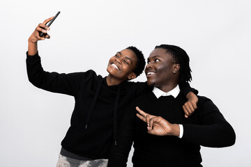 Pretty black african american couple man and woman wearing black clothes having video conference on...