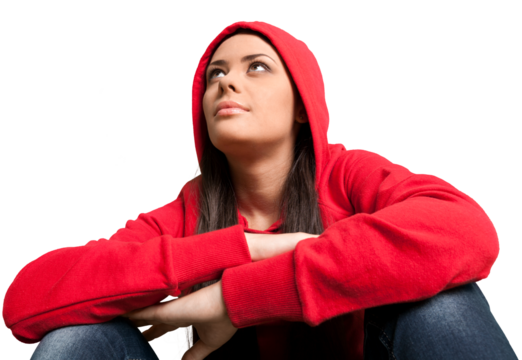 Portrait of beautiful young casual girl sitting on a white background