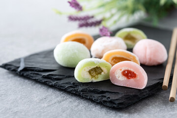 Japanese colorful mochi on gray stone surface