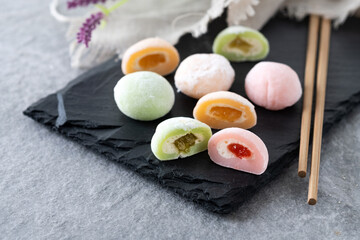Japanese colorful mochi on gray stone surface