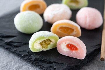 Japanese colorful mochi on gray stone surface. Close up