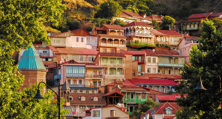 Colorful traditional houses with wooden carved balconies in the Old Town of Tbilisi, Georgia.