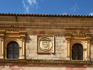 heraldic shields on the wall in the cathedral of Sigüenza