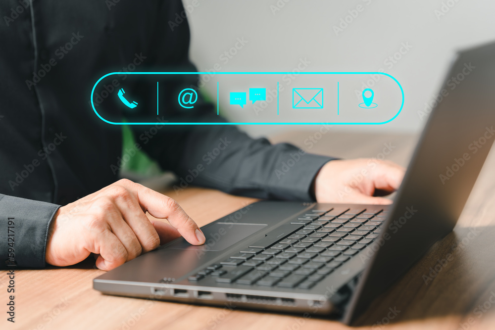 Poster Client man using computer laptop with the virtual screen on the call phone, email, address, chat message and map icons. Customer support hotline contact us people connection concept.