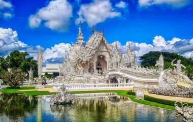 Fototapeta na wymiar Famous Thailand temple or grand white church, Wat Rong Khun,at Chiang Rai province, northern Thailand