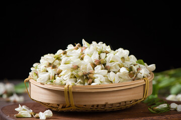 fresh acacia blossoms flowers on wooden table.Robinia pseudoacacia .