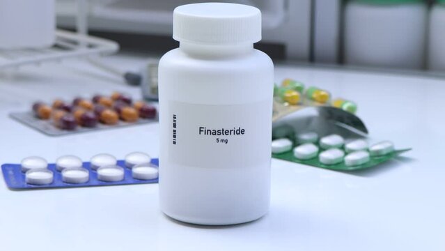Finasteride pill in white bottle, pill stock, medical or pharmacy concept