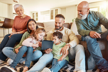 Love, home and family on a couch, tablet and streaming movies on break, weekend and relax together. Grandparents, mother or father with children, siblings or kids in lounge, social media and chilling