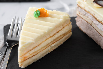 Traditional carrot cake portion on white marble