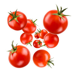 Small red cherry tomatoes floating on white background.