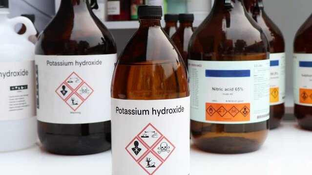 Potassium hydroxide, Hazardous chemicals and symbols on containers, chemical in industry or laboratory 