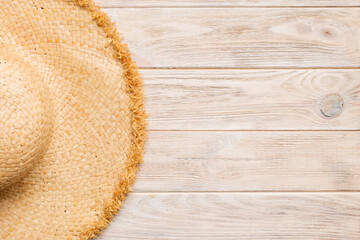 Summer holidays. Summer concept with straw hat and tropical leaf. Flat lay, top view, copy space