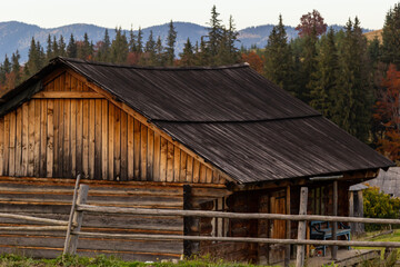 Fototapeta na wymiar Traditional wooden mountain hut, farm building in the Ukrainian Carpathians