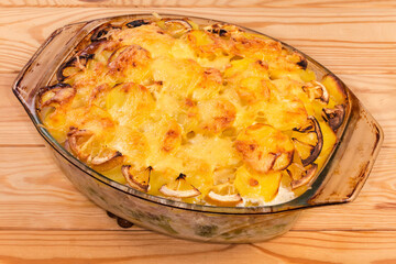 Baked vegetable and fish casserole in the glass baking dish