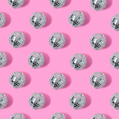 Disco ball pattern on pink pastel background. Minimal party concept. Flat lay.