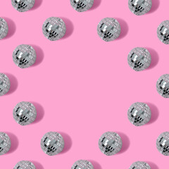 Disco ball on pink background with copy space. Minimal party concept.