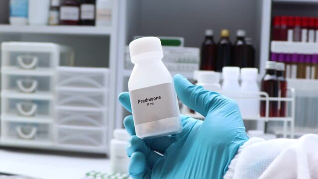 Prednisone pill in white bottle, pill stock, medical or pharmacy concept