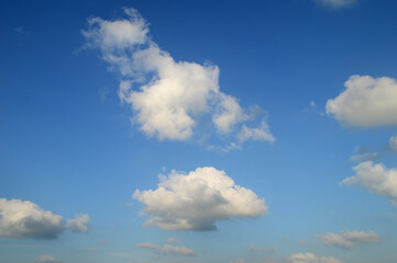 Fototapeta na wymiar white fluffy clouds in the blue sky