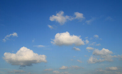 Obraz premium white fluffy clouds in the blue sky