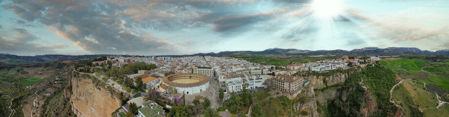 Fototapeta na wymiar Aerial view of Ronda Plaza de Toros and medieval cityscape. This is the major white town of Andalusia, Spain