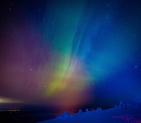 Aurora Borealis Known as Norther Lights Playing with Vivid Colors Over Lofoten Islands in Norway.