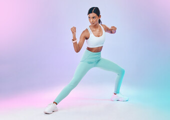 Fototapeta na wymiar Fitness, woman and fighting pose in studio for karate, martial arts or defence training on gradient background. Power, sports and indian female in intense workout, exercise and posing while isolated