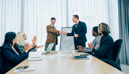 Professional business people are working and shaking hands while working in the creative office.