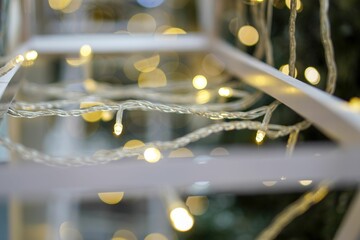 a window with christmas lights and the bottom of it is in focus