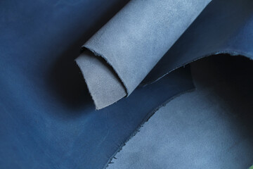 collection of high-quality blue leather swatches in various shades, showcasing their natural elegance and versatility. color trends in interior design or fashion