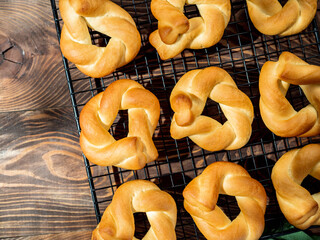 Taralli twist on wooden background. Typical italian ring-shaped or doughnut-shaped biscuit cookies...