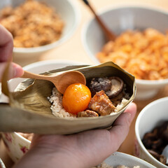 Making zongzi food - preparing and wrapping Chinese rice dumpling.