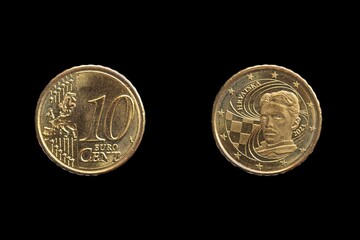Closeup of two Croatian Euro coins isolated on a black background