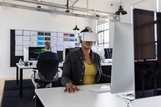 Businesswoman in an office about to join a meeting in the metaverse