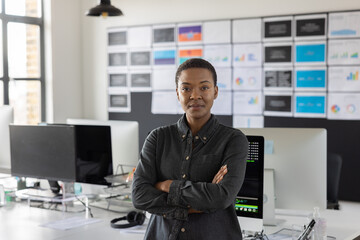 Portrait of young female coder in an office